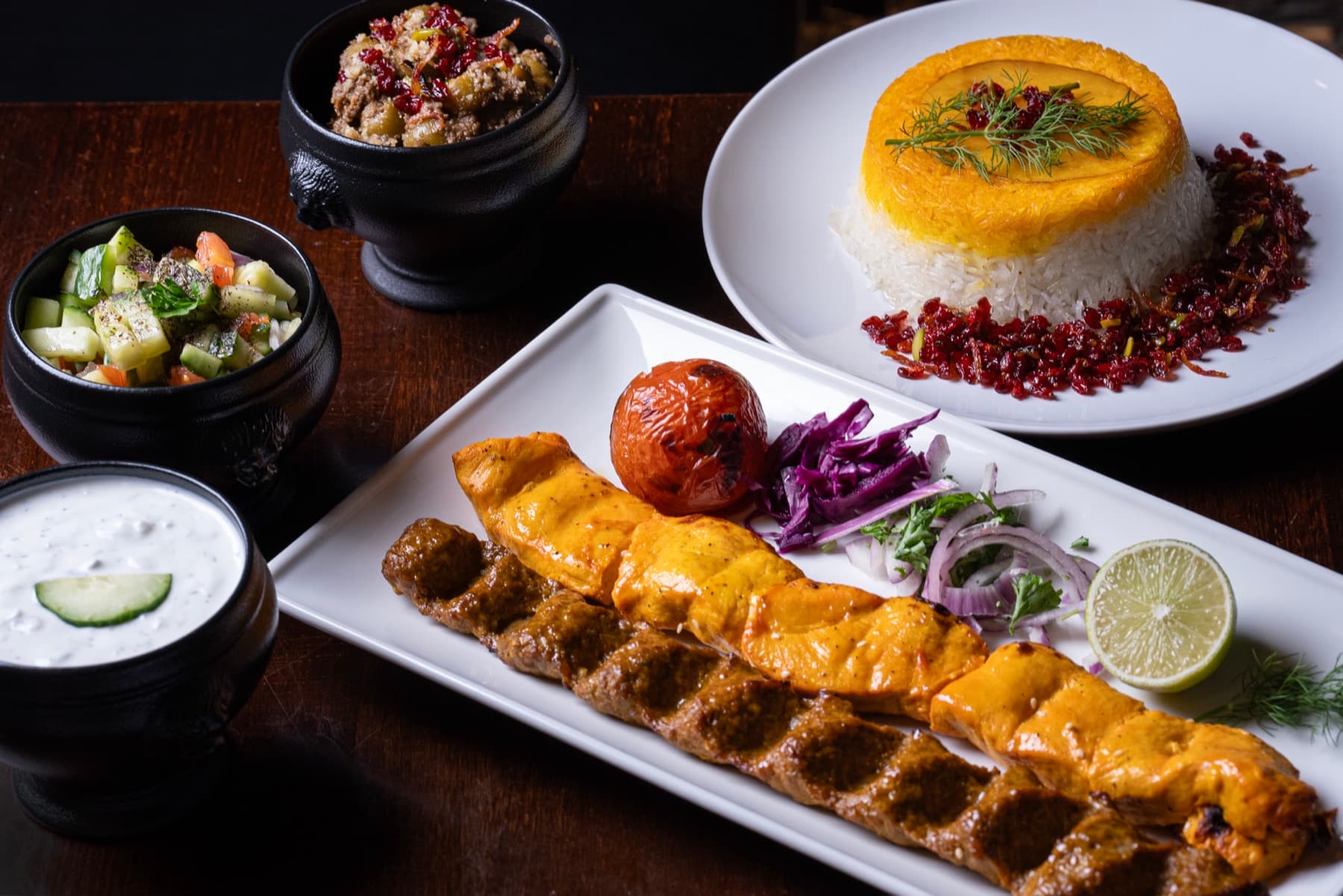 Vaziri with koobideh and grilled chicken, saffron tahdig, and salads